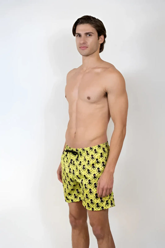 Bright yellow octopus print swim shorts with repeating black pattern perfect for beachwear and swimming
