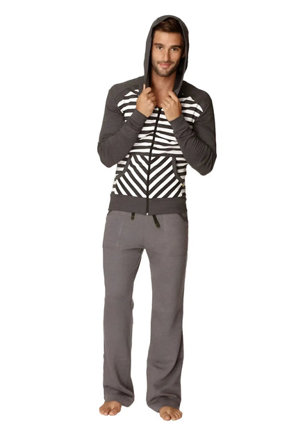 A man wearing an original limited edition form-fit crossover yoga track charcoal stripe fleece hoodie with matching pants