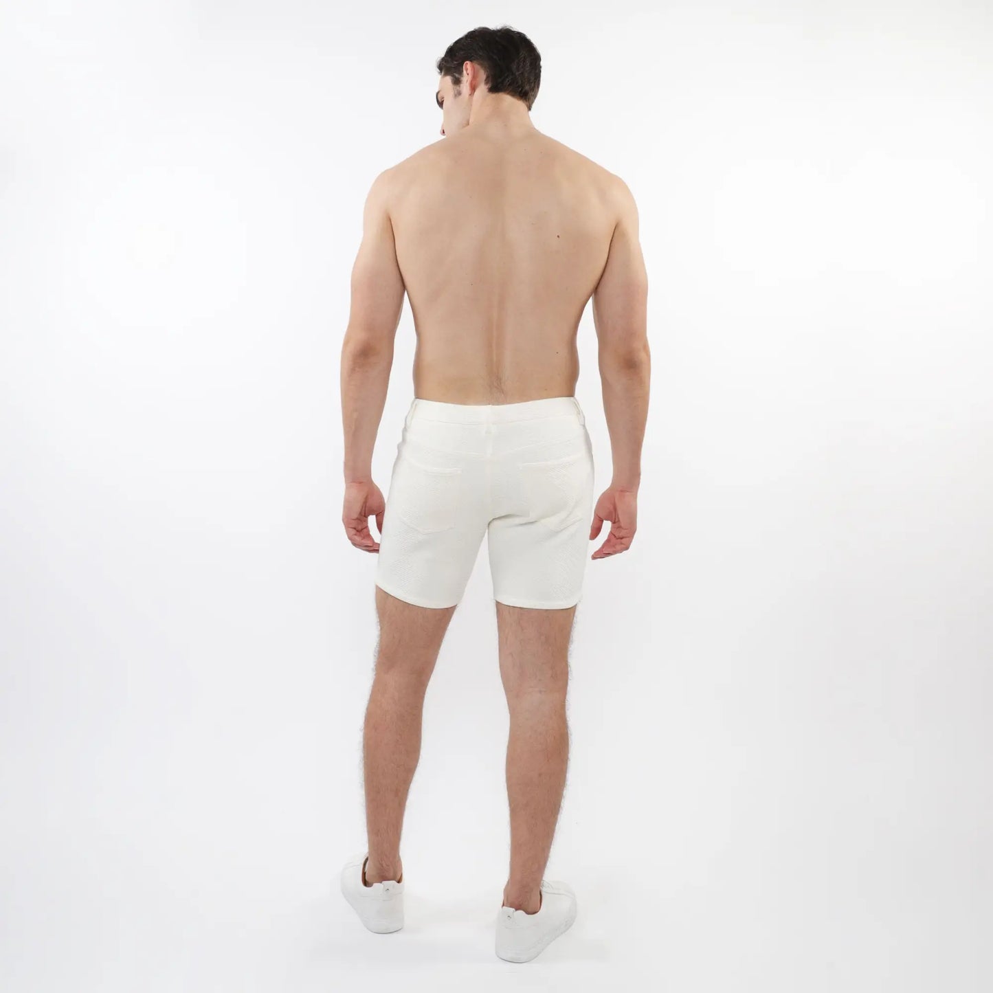 White parquet jacquard stretch knit athletic shorts with clean minimalist design for active wear