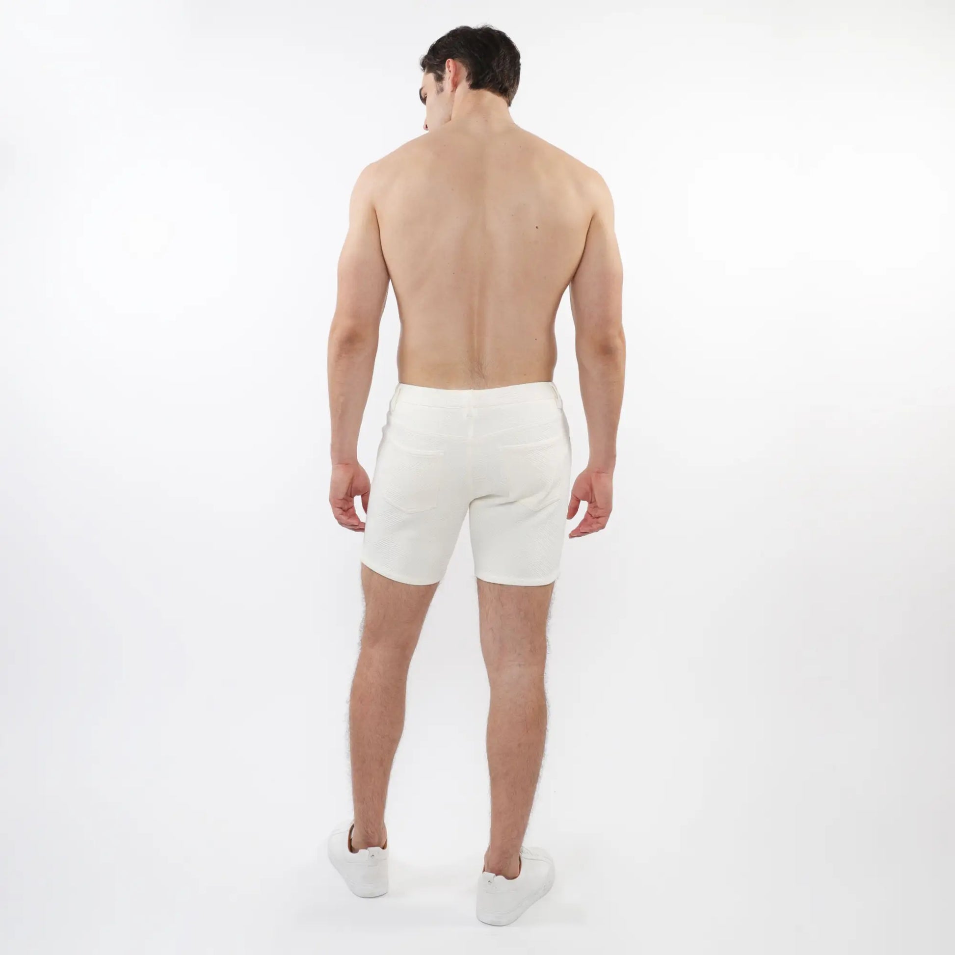 White parquet jacquard stretch knit athletic shorts with clean minimalist design for active wear