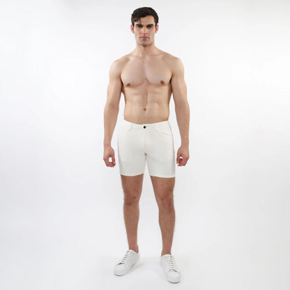 White parquet jacquard stretch knit athletic shorts with sleek minimalist design and single black button waistband