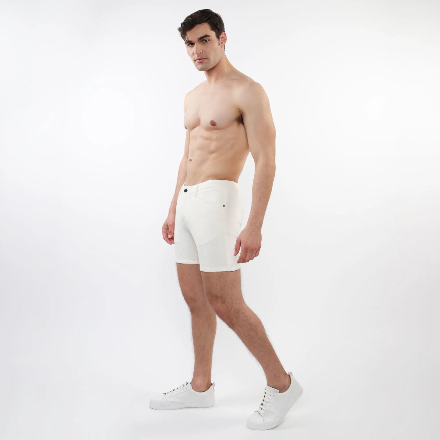 White men’s parquet jacquard stretch knit short briefs with sleek minimalist design and subtle black button accents