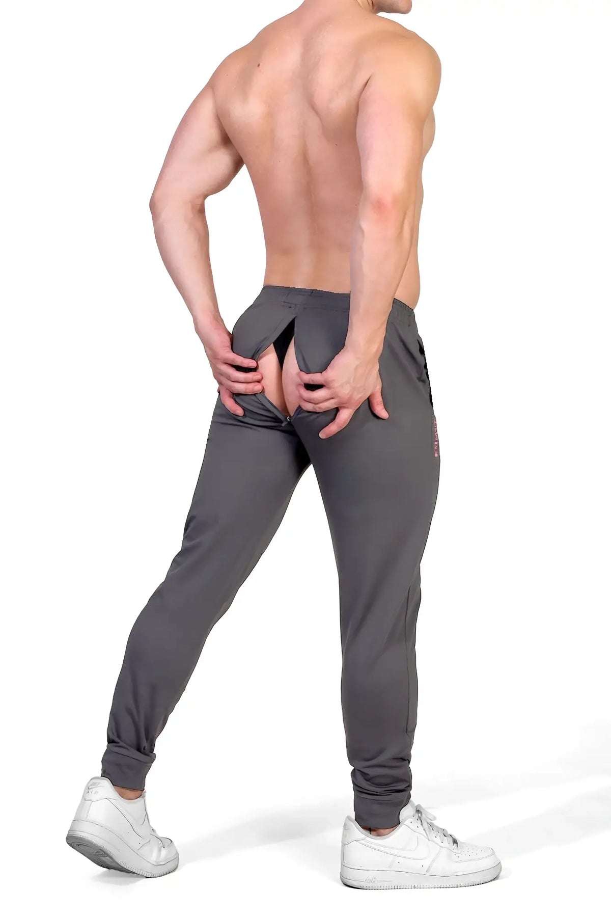 Back view of peek-a-boo joggers dark grey gray athletic joggers with a split back sleek fit and subtle side branding