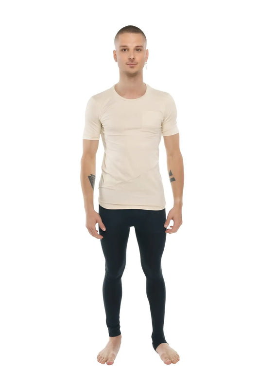 A man wearing a beige perfect pocket crew-neck tee with short sleeves and black fitted leggings
