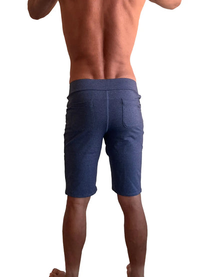 Back view of performance premium urban tactical dress shorts in navy blue heather denim with elastic waistband and two pockets