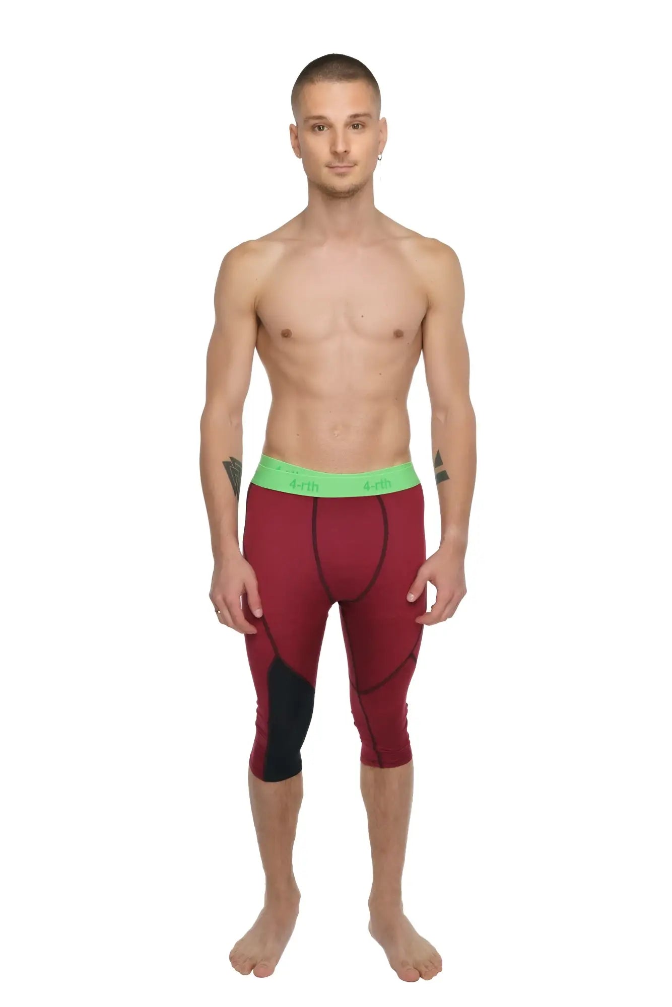 Performance yoga leggings 3/4 length in maroon and black with a bright green waistband for athletic use