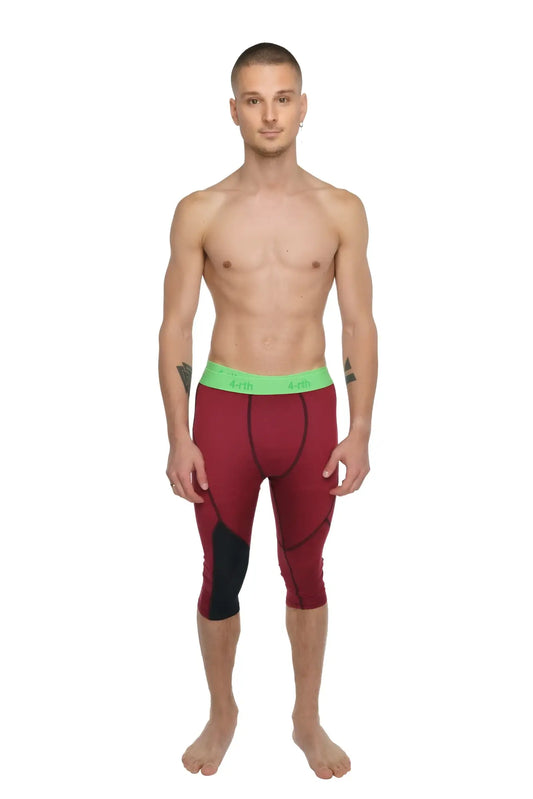Performance yoga leggings 3/4 length in maroon and black with a bright green waistband for athletic use