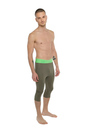 Olive green capri-length performance yoga leggings with bright neon green waistband for active wear