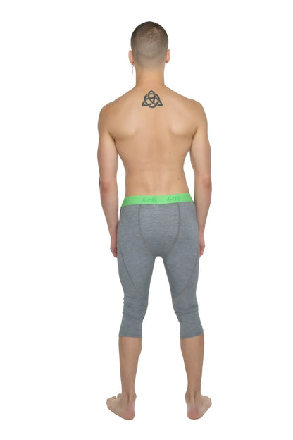 Gray heathered performance yoga leggings 3/4 length with a bright green waistband for active wear