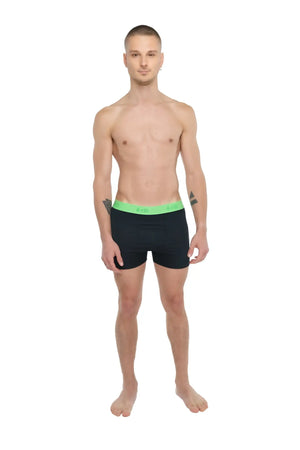 Black boxer briefs with bright green elastic waistband featuring avli logo designed for performance and comfort