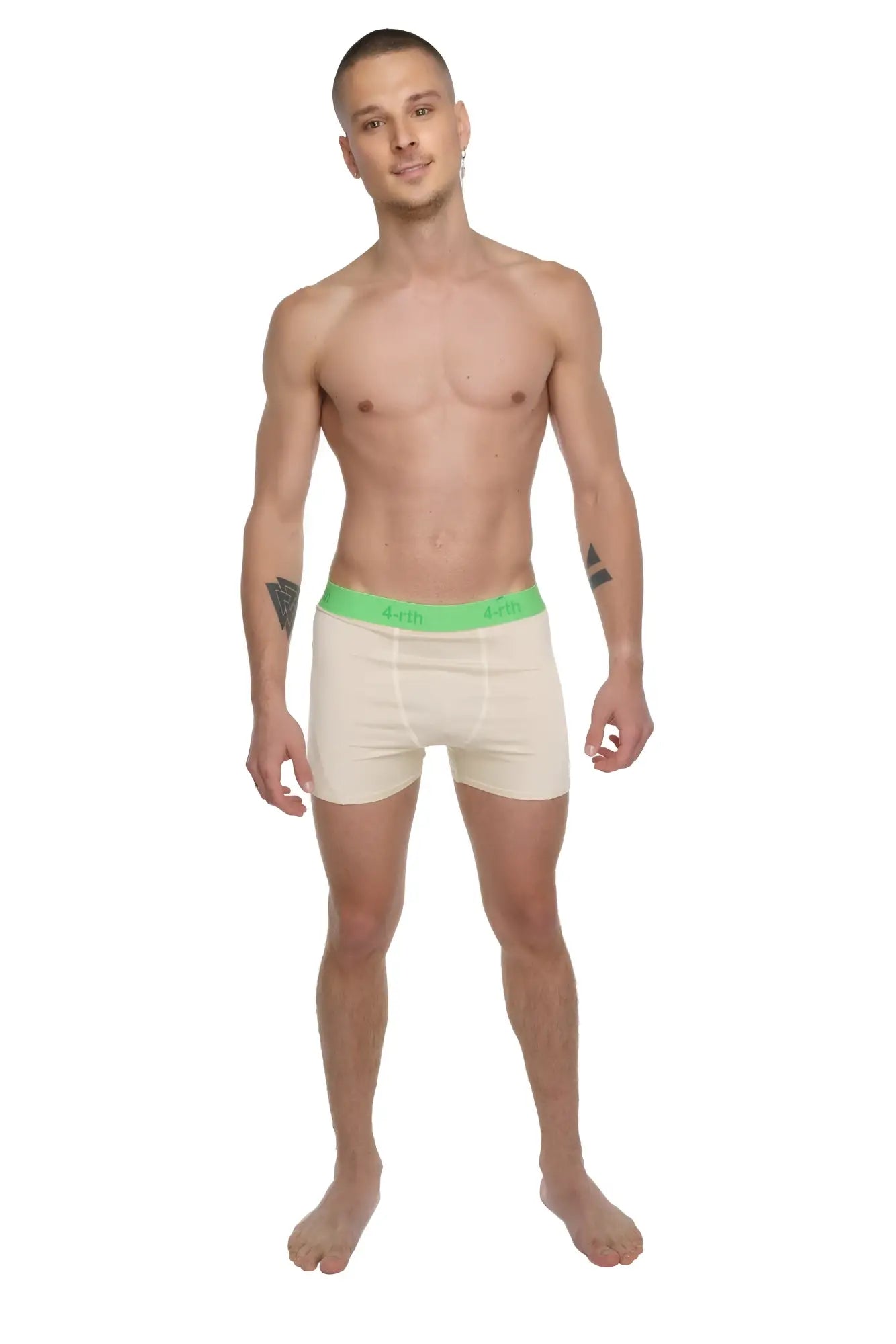 Cream-colored boxer briefs with bright green elastic waistband and brand logo featured in performance yoga leggings short sand beige collection