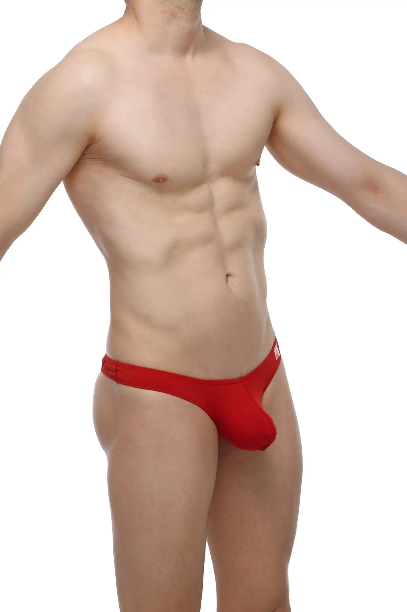 Petitq bikini capri red form-fitting thong with smooth fabric finish and minimalistic design shown from back side
