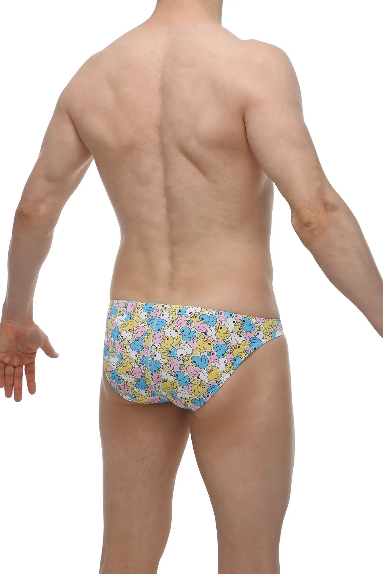 PetitQ bikini chill duckies swim trunks with pastel yellow blue and pink cartoon ducks on white background