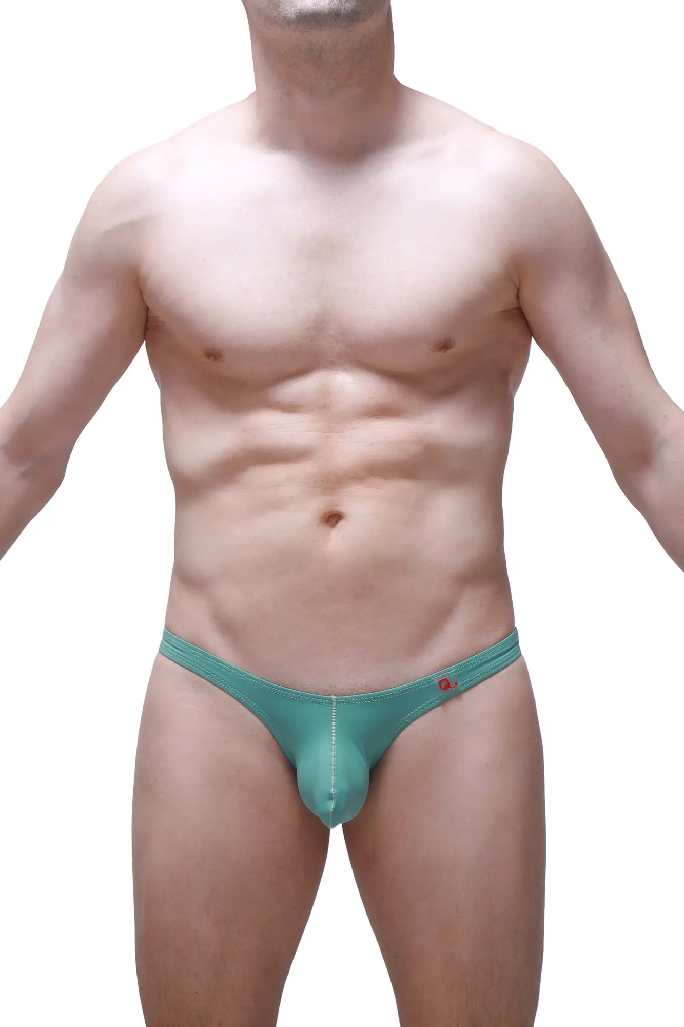 Teal-colored form-fitting men’s thong with subtle seam detail and red logo on waistband petitq bikini dome green