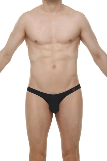 Black men’s thong bikini dome skine black with subtle red logo on waistband shown from the back side