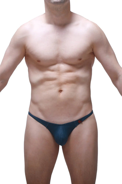 Dark blue form-fitting thong with subtle red logo on the side by petitq in prussian blue color