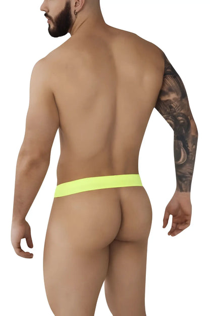 Neon yellow thong with snug seamless fit from pikante pik 0980 angola ball lifter c-ring in green color shown from back side
