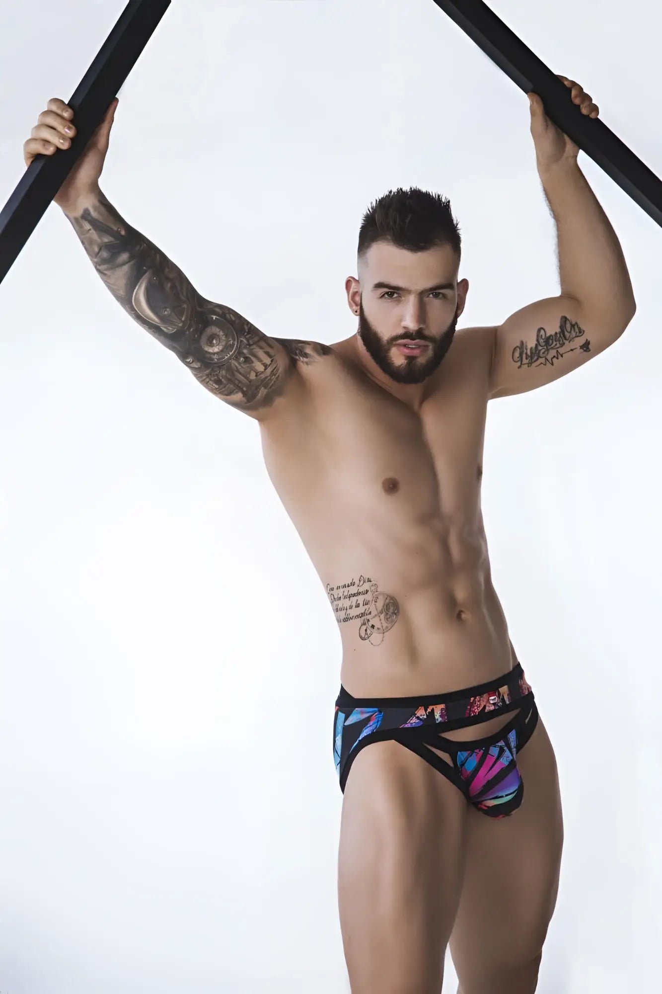 Black briefs by Pikante PIK 0989 Jartum featuring vibrant blue purple and pink abstract geometric patterns