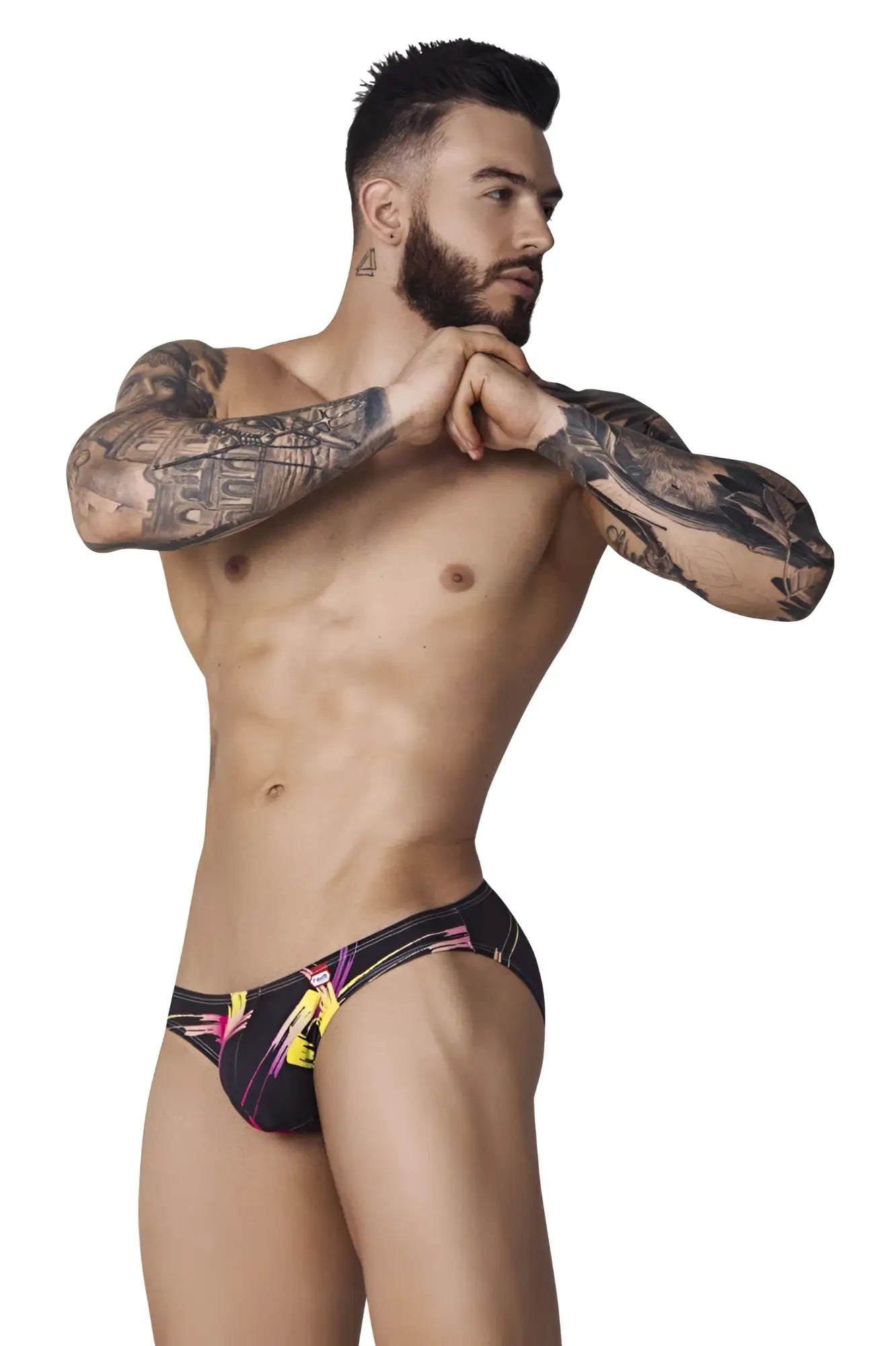 Black swim trunks with vibrant neon pink and yellow geometric patterns from pikante pik 1076 nucleus jockstrap collection