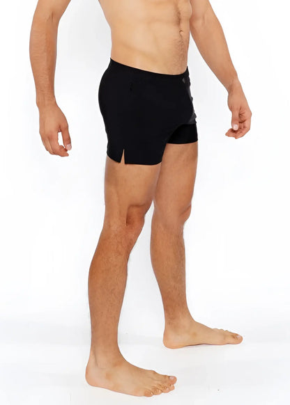 Black pinstripe swim short with sleek form fitting design and subtle side slits for athletic performance