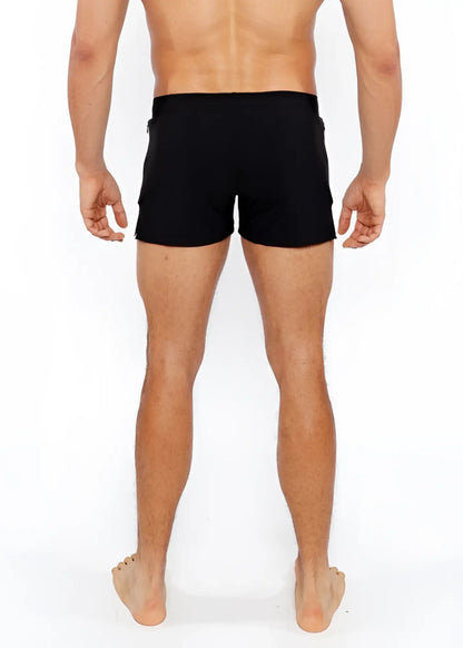 Black pinstripe swim short with sleek form-fitting design and subtle side pockets for athletic use