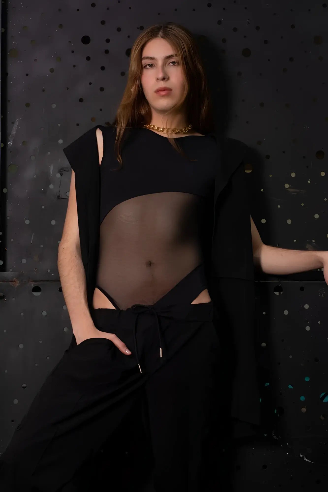 Black sheer PLURAL PL002 bodysuit crop top with cut-out details and a draped sleeve for stylish wear