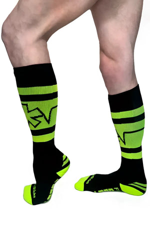 Pocket socks neon green and black athletic compression socks with bold stripes and stylized calf logo back view