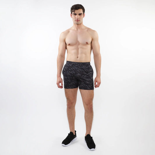 Black printed mesh stretch performance shorts with subtle geometric leaf pattern made from lightweight athletic fabric