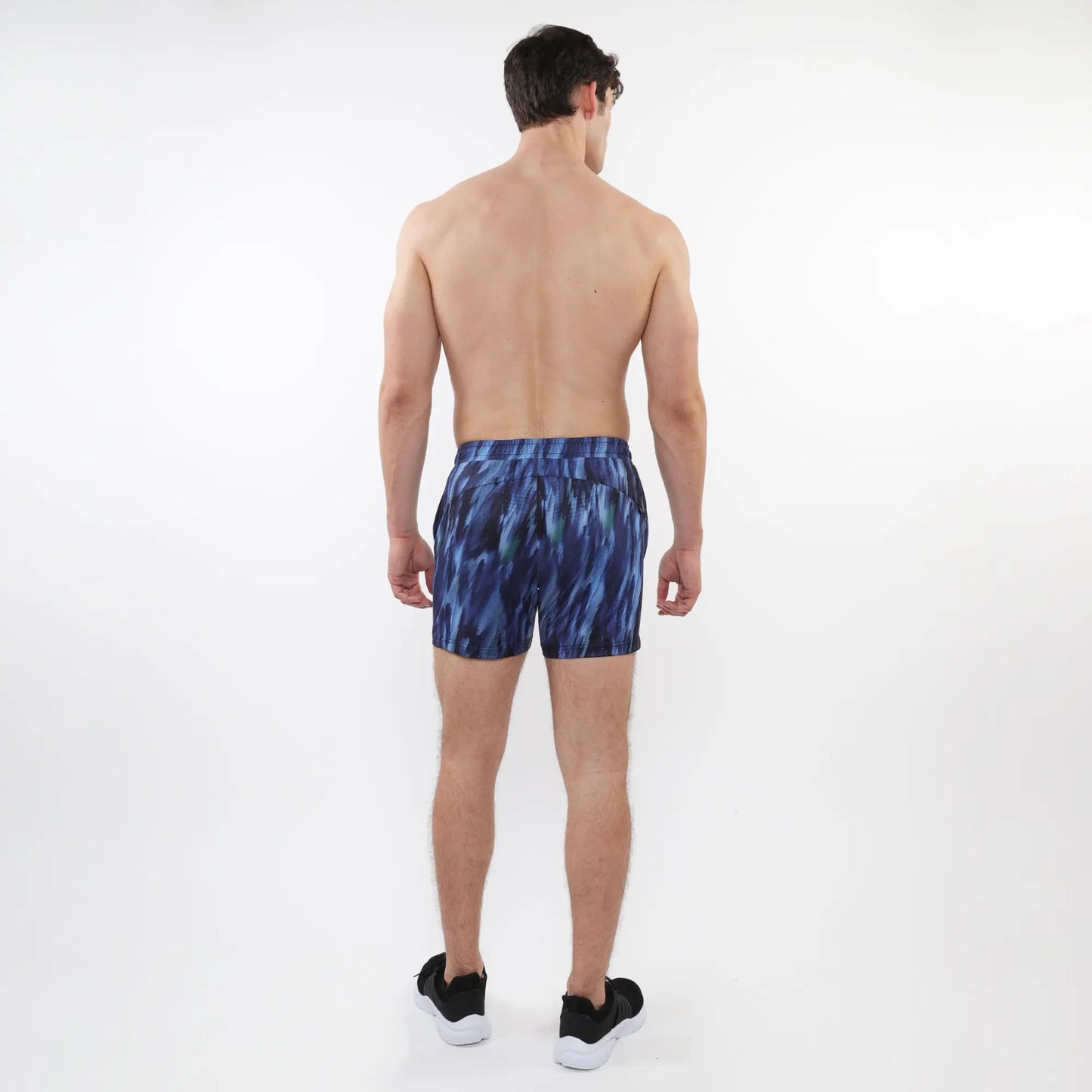 Printed mesh stretch performance shorts in blue with abstract pattern and fitted waistband for athletic use