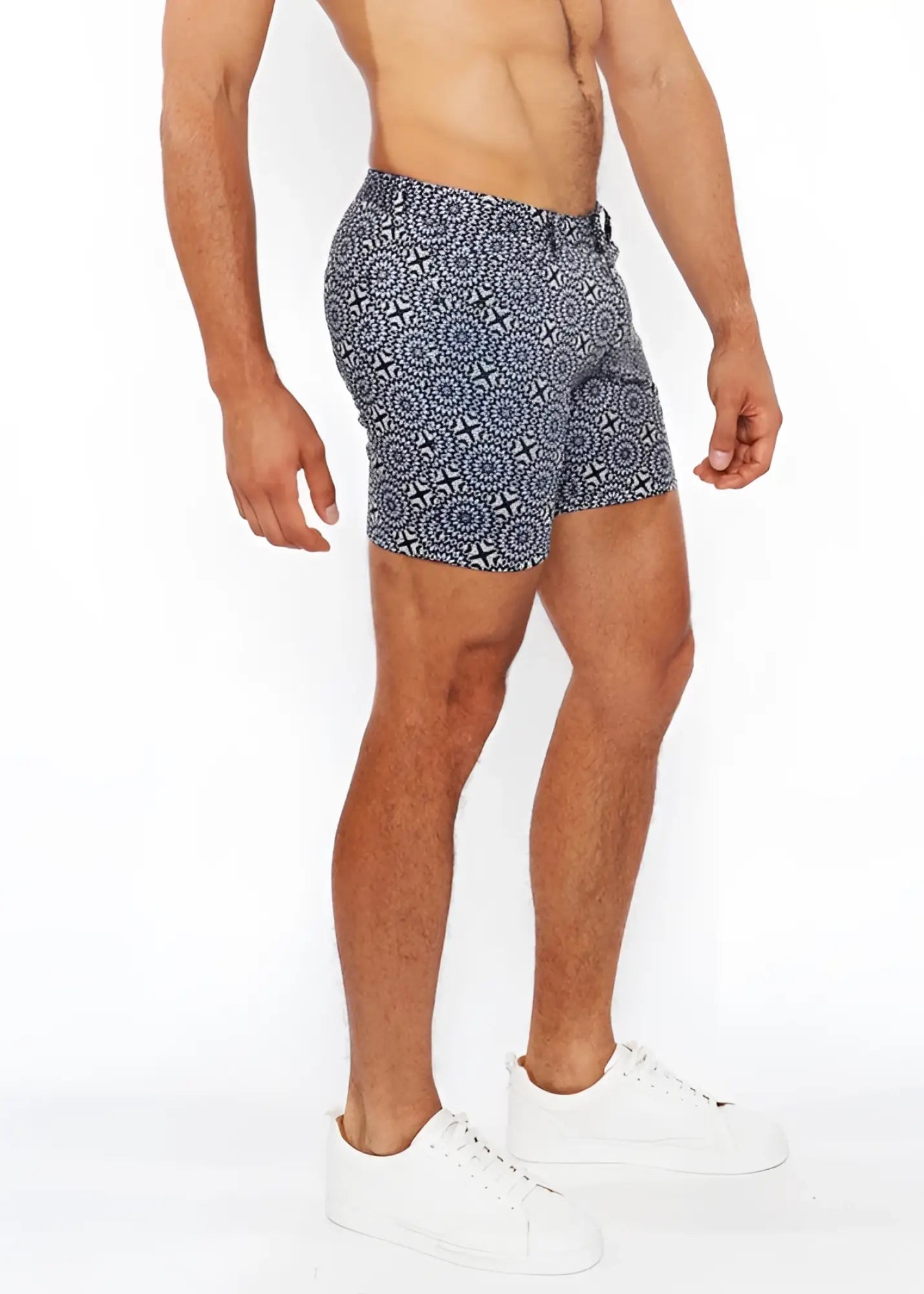 Printed stretch knit short swim trunks in blue and white geometric patterned fabric designed for comfort and style