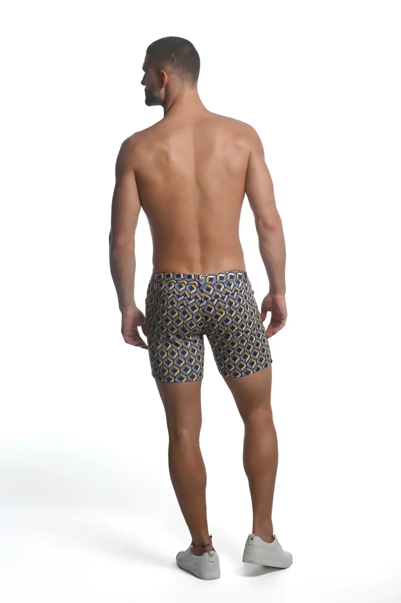 Printed stretch knit short men’s swim trunks with a geometric navy beige and gold pattern for beachwear