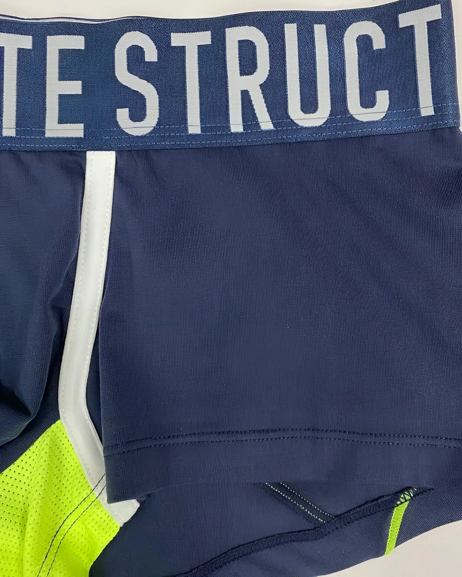 Navy blue Private Structure BAUT4389 athlete trunks with neon green accents and bold struct waistband logo