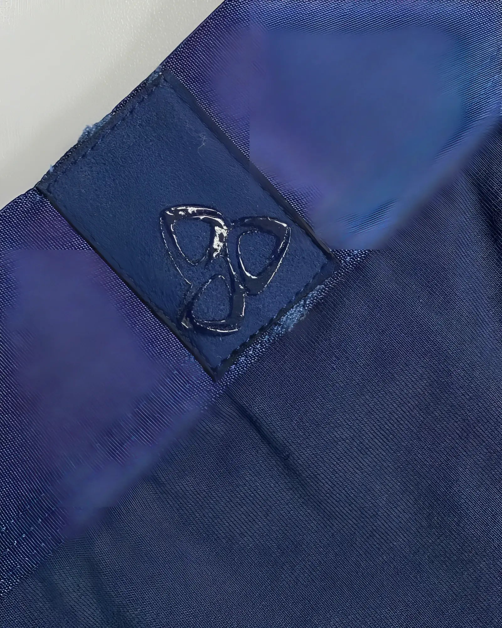 Dark blue fabric patch with glossy embossed logo stitched on navy ranger private structure baut4389 athlete trunks