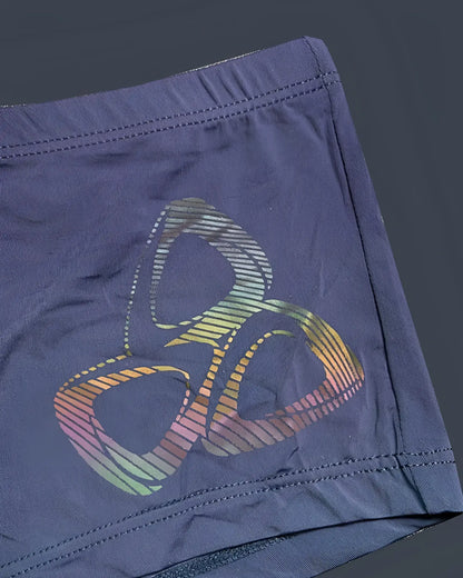 Dark blue silk athletic shorts with vibrant rainbow-striped abstract logo by private structure bruth4390 bare hipster