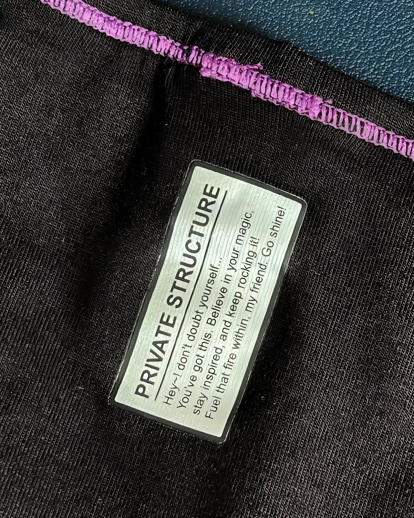 Black private structure prime eutopia bikini brief with purple stitched hem and silver label in charcoal color