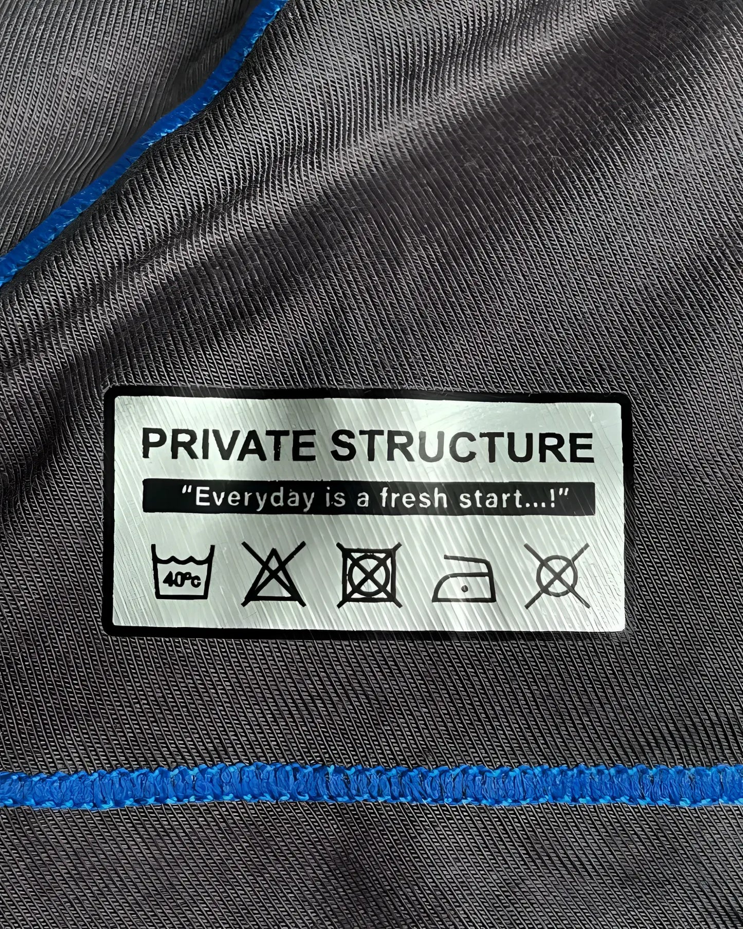 Gray private structure epus4570 prime elysian hipster fabric with blue stitching and white care label on back side