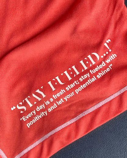 Red cotton t-shirt by private structure with white embroidered stay fueled text and motivational quote in red
