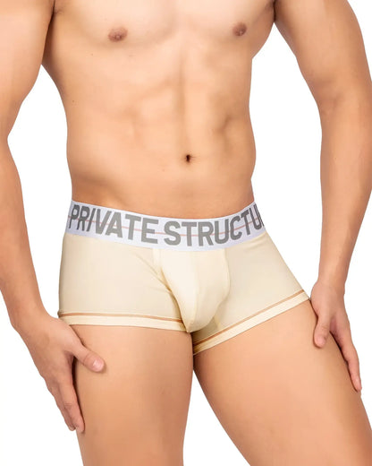 Beige Private Structure Mo Lite mid waist trunks with gray elastic waistband and bold black logo lettering