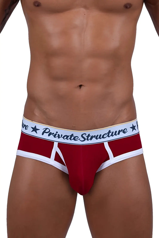 Red men’s briefs with white trim and private structure waistband featuring black lettering and star motifs