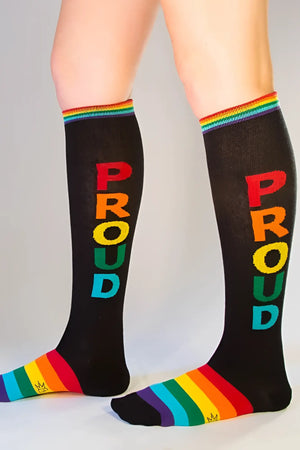 Black knee high socks with proud in rainbow letters and matching rainbow striped cuff and toe for pride wear