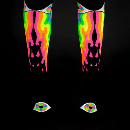 Psychedelic eye knee high socks featuring neon flame patterns with black silhouettes and eye motifs at the toes