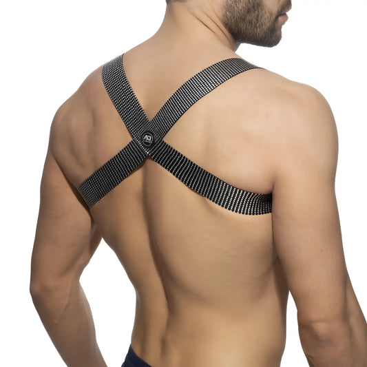 Black mesh crossback strap with skull logo at center shown on the back of pushpin spider harness