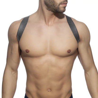 Black mesh shoulder straps with subtle grid pattern on the pushpin spider harness back side