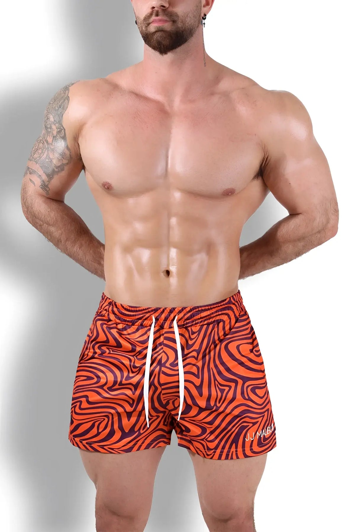 Quick-dry mesh shorts with orange and black wavy pattern and white drawstrings designed for swimwear use