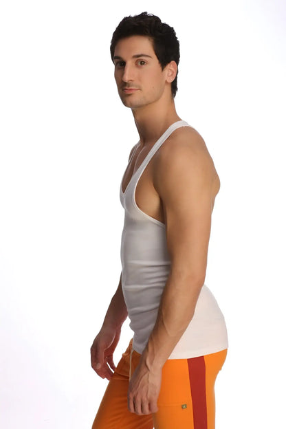 A man wearing a white racer-back yoga tank with thin straps and a v-neckline made of lightweight fabric