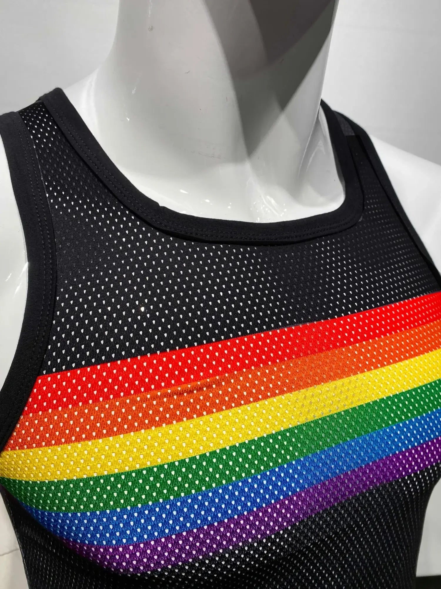 Black mesh tank top with a vibrant rainbow chest stripe perfect for casual and sporty looks