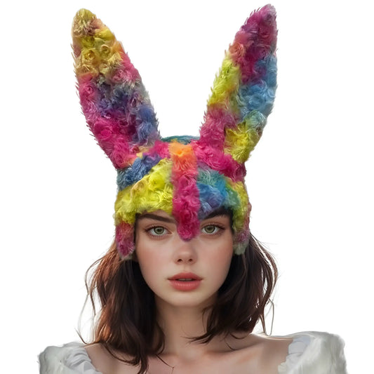 A vibrant rainbow fuzzy bunny mask knitted hat with long ears and fluffy texture for cozy wear