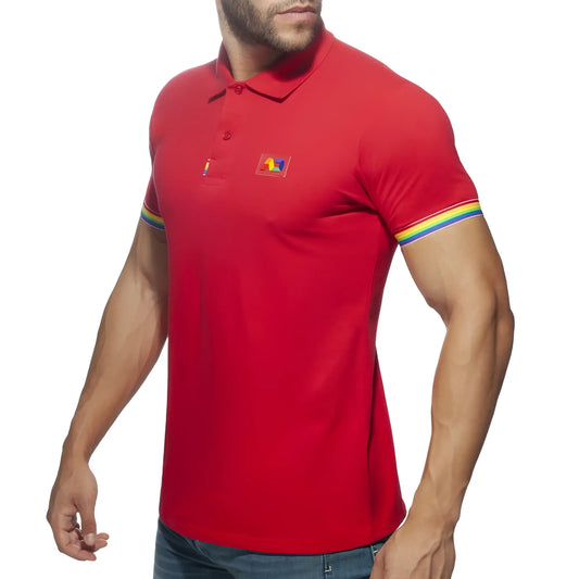 Red men’s cotton polo shirt with rainbow trim on sleeves and a small colorful logo patch on the chest