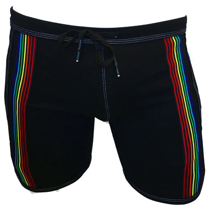 Black swim trunks called rainbow ribbon shorts featuring vibrant rainbow stripes down each side for beachwear