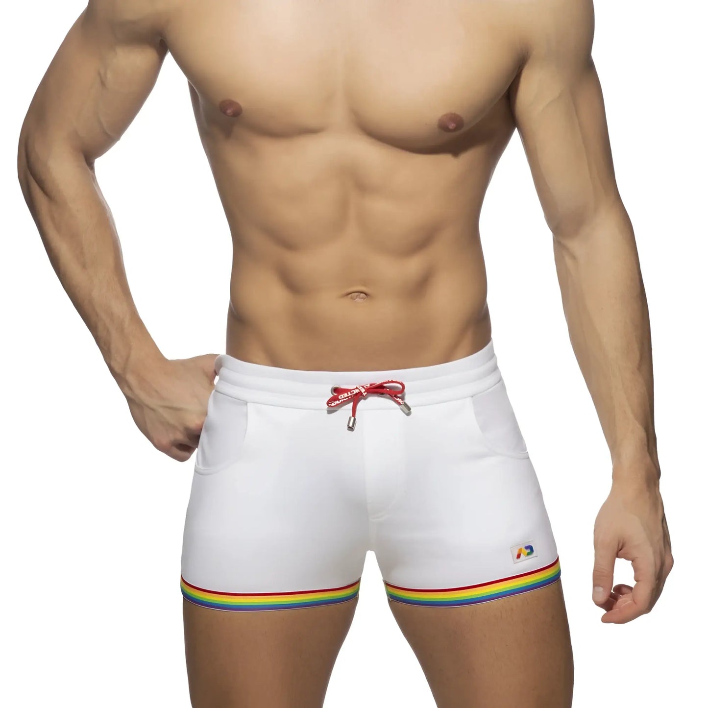 White cotton swim trunks with rainbow tape trim and red drawstring designed for casual beachwear